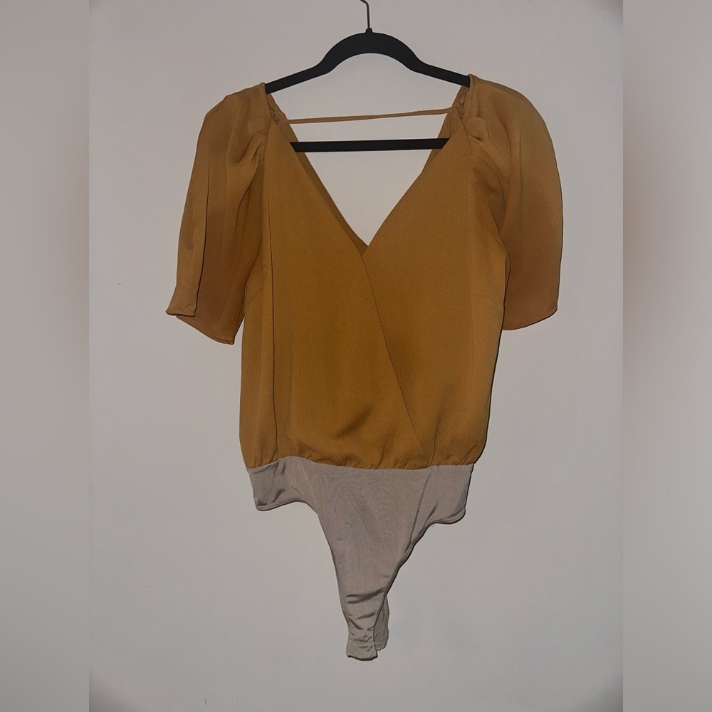 ASTR Yellow short sleeve bodysuit. Size Small. V neck with clasp hook.